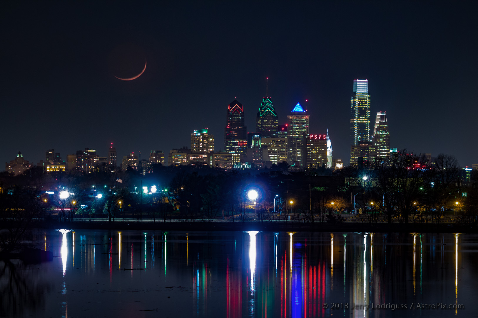 The crescent Moon sets over the Philadellphia skyline on April 1, 2014.