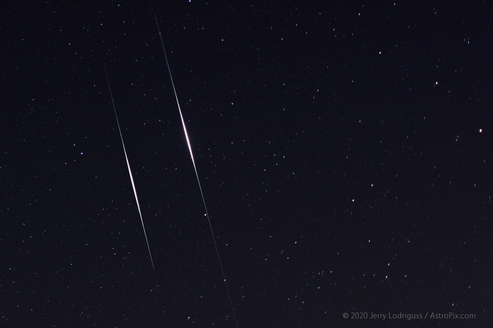 Two Iridium satellites "flare" together as they pass through Ursa Minor. The flares are caused by direct sunlight reflecting off of mirrored parts of the communications satellites.