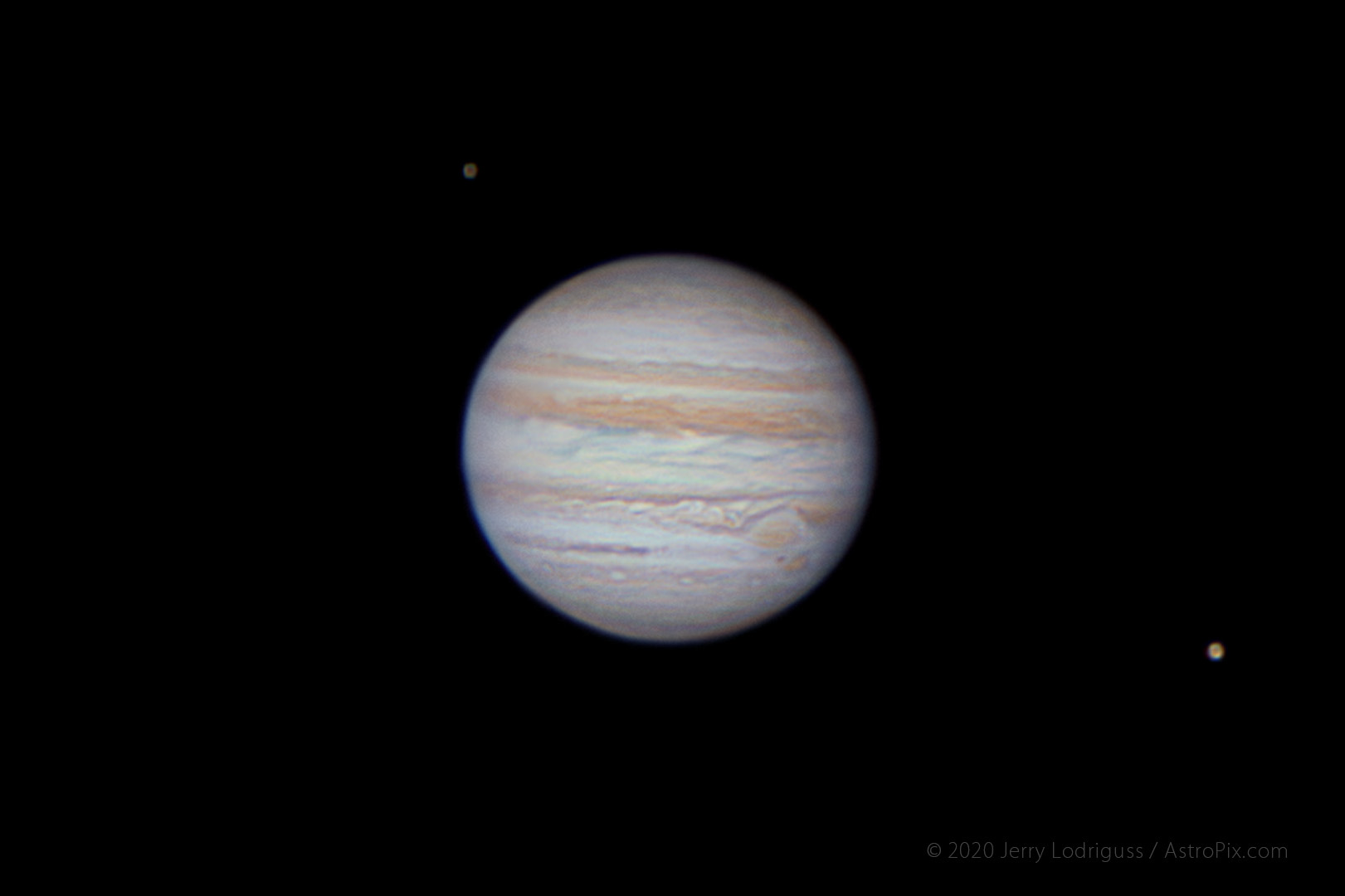 Jupiter and the Great Red Spot, and its moons Callisto and Ganymede, are seen here.