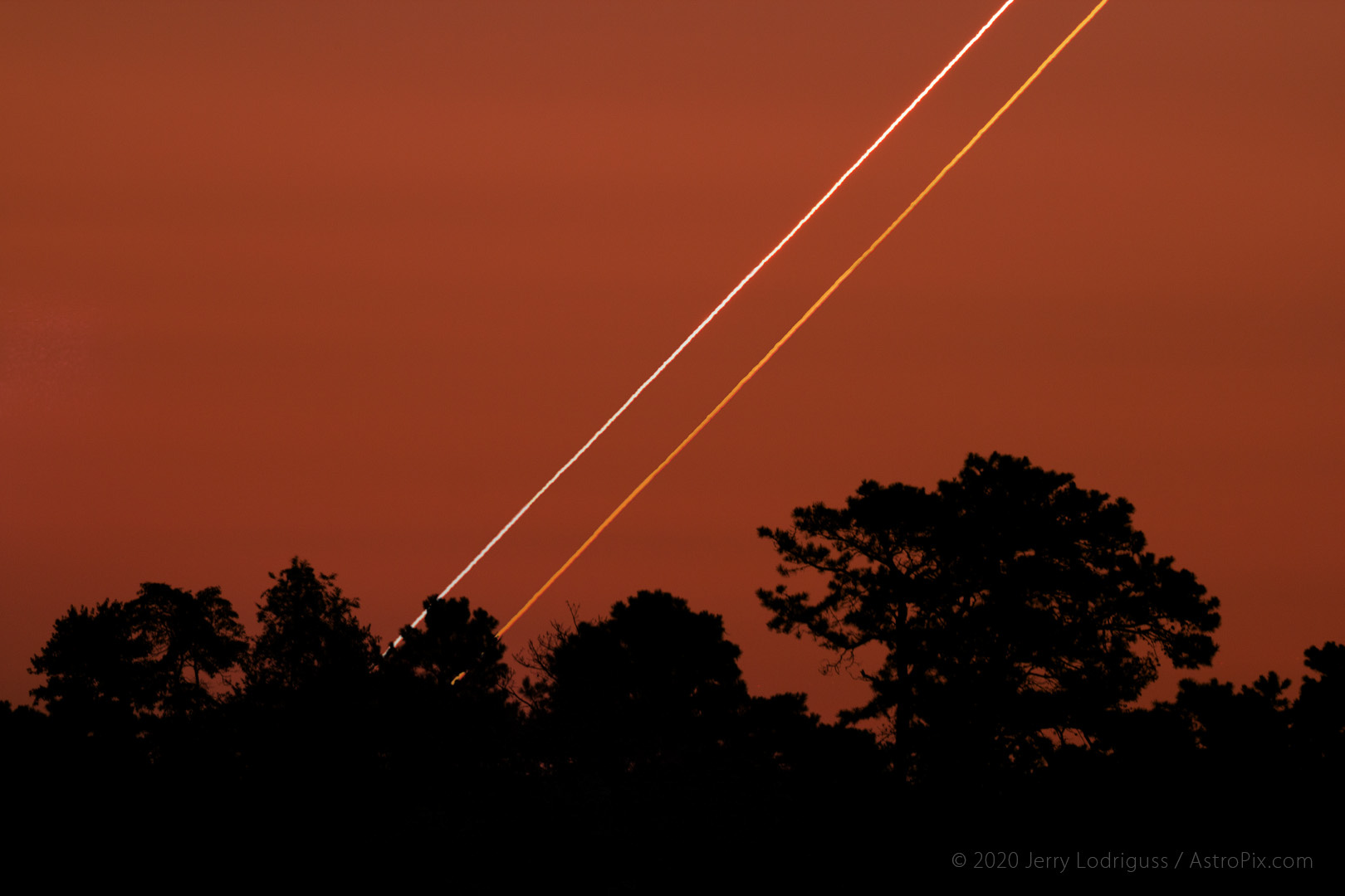 Venus and Jupiter rise in conjunction as the sky reddens from the coming sunrise on August 18, 2014.