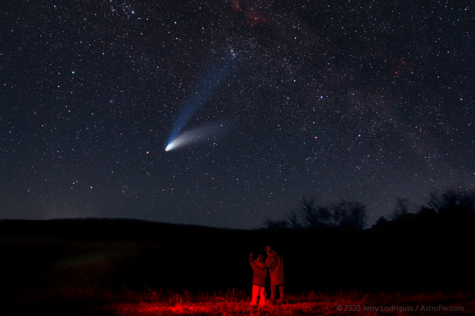 Two young brothers watch comet Hale-Bopp set on April 1, 1997, the day of perihelion, the comet's closest approach to the Sun.