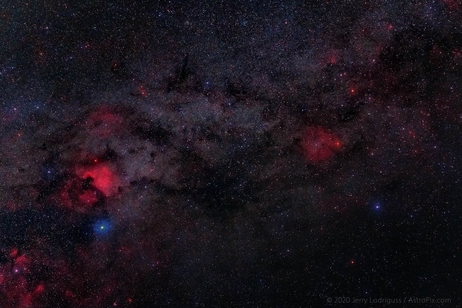 The shadowy filaments of Le Gentil 3, a very large dark nebula complex, fill the area of sky in the center of the frame between Deneb and the North America Nebula in Cygnus at left and Herschel's Garnet Star and IC 1396 in Cepheus at right. <br /><br />Le Gentil 3 is named after the French observer Guillaume-Joseph-Hyacinthe-Jean-Baptiste Le Gentil de la Galaziere, who observed and cataloged it in the 1700s.