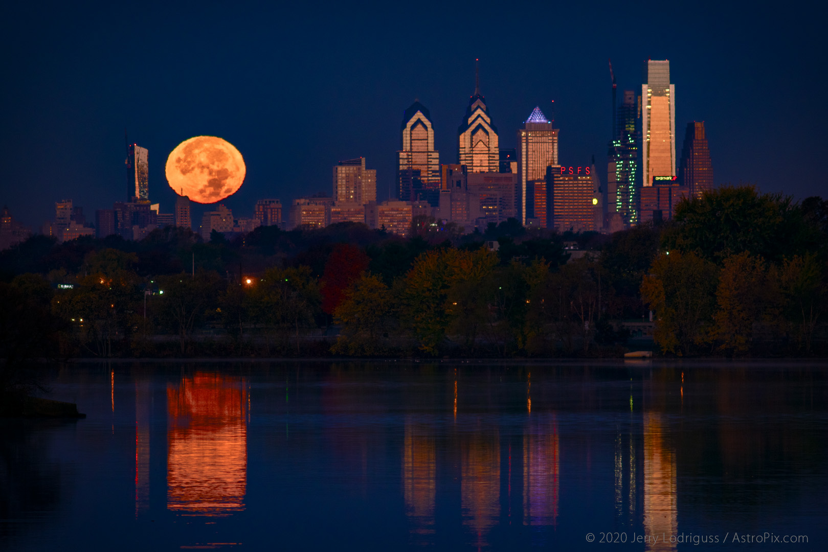 The Supermoon of November 14, 2016 sets as dawn lights up the buildings of the Philadelphia skyline.