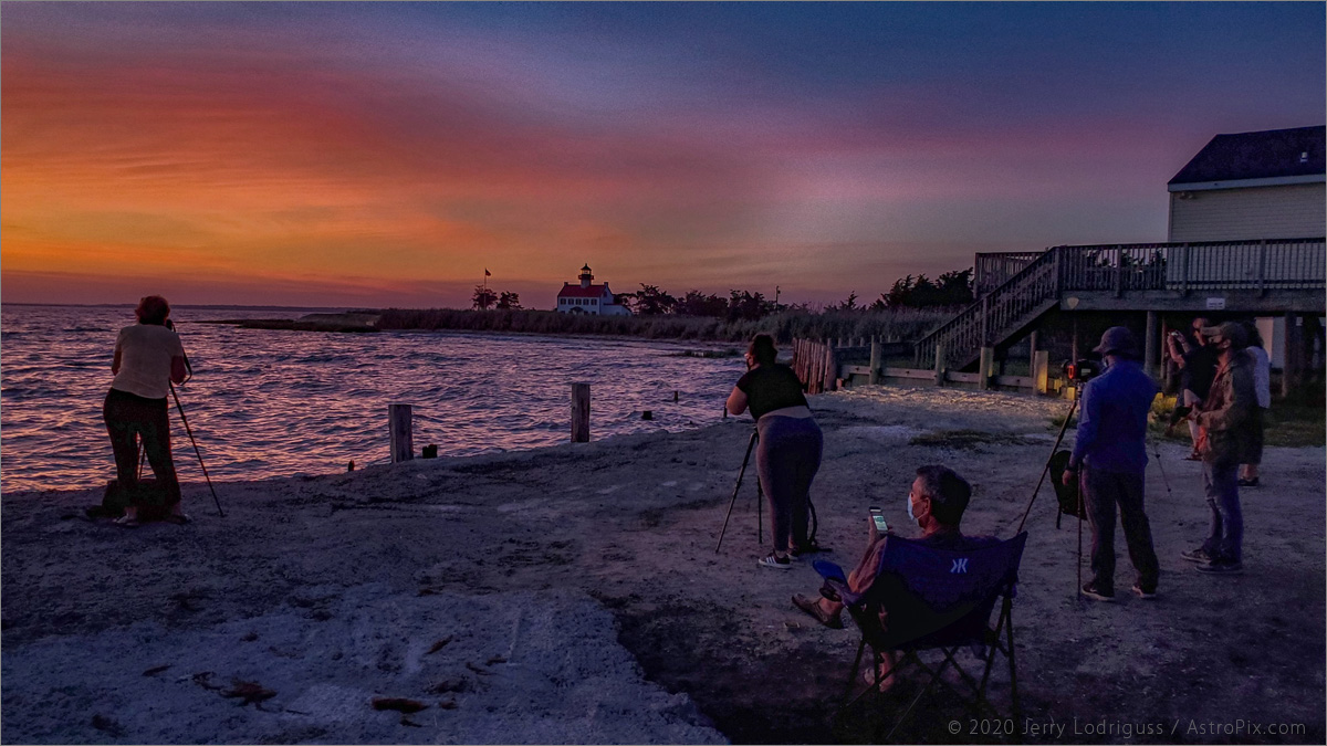 Photographers and observers watch the sunset from East Point on July 18, 2020.<br /><br />Galaxy S10 cell phone<br />4.3mm focal length lens<br />1/70th second exposure at ISO 200 at f/2.4