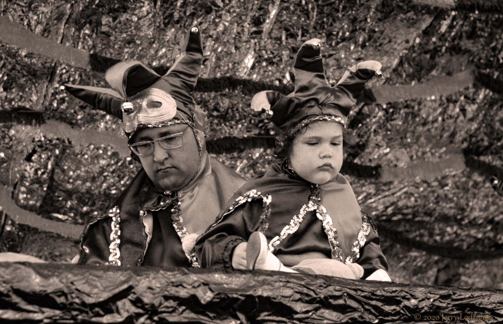 Father and son on float, Mardi Gras, New Orleans.