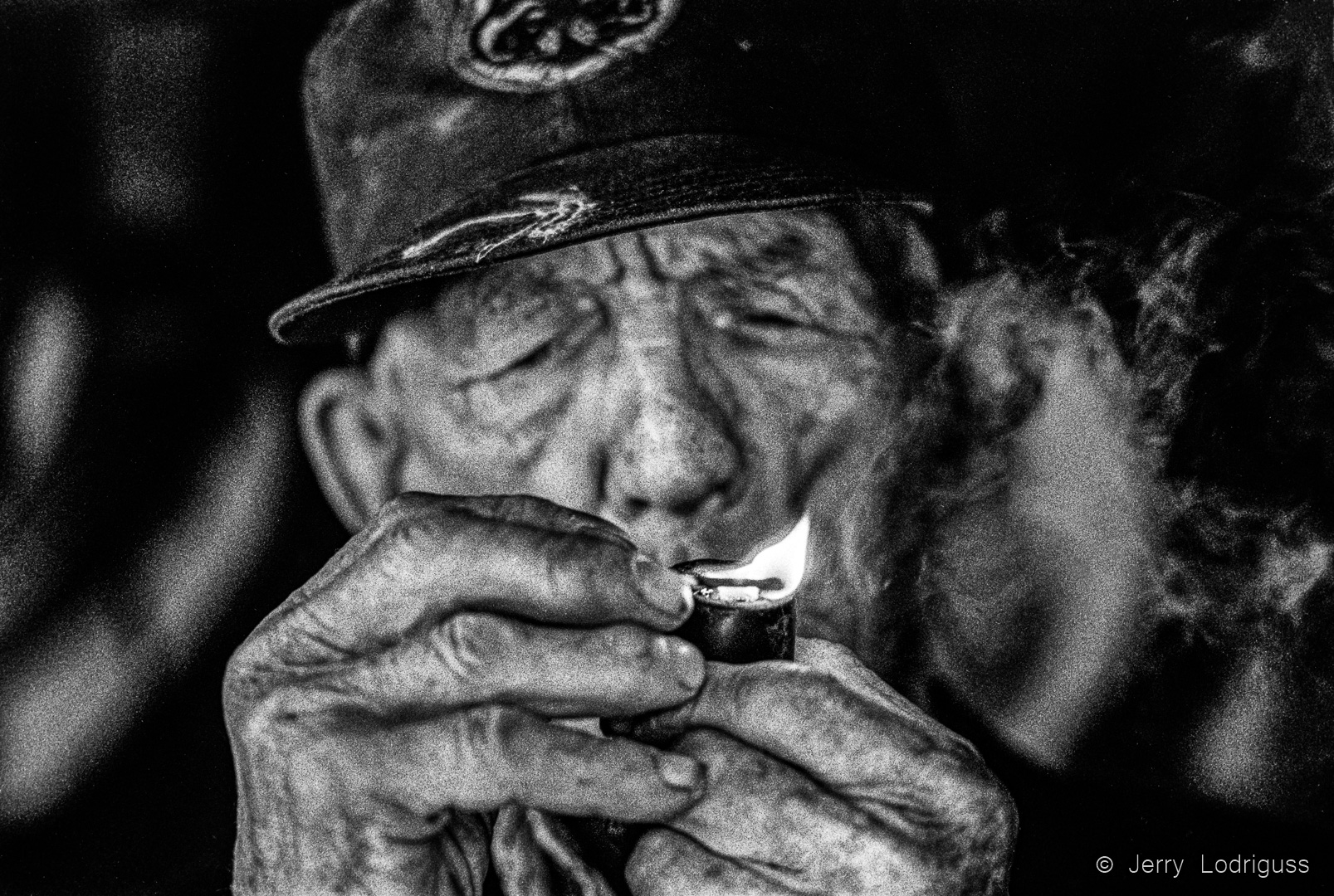93-year old Frank Hodges lights his favorite pipe. “I only started smoking this thing a couple of years ago to pass the time, but if the price of tobacco keeps going up, I may have to give it up.”