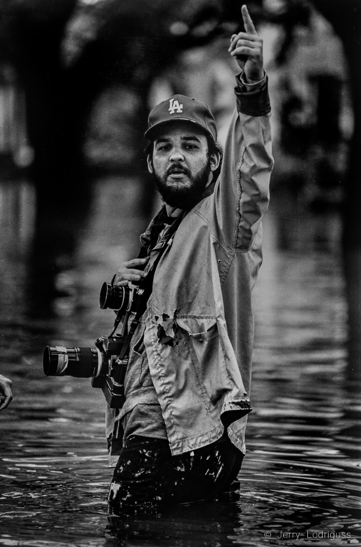 Jerry Lodriguss covering floods outside the front door of his apartment during 1980 flooding. Photo by G. Andrew Boyd.