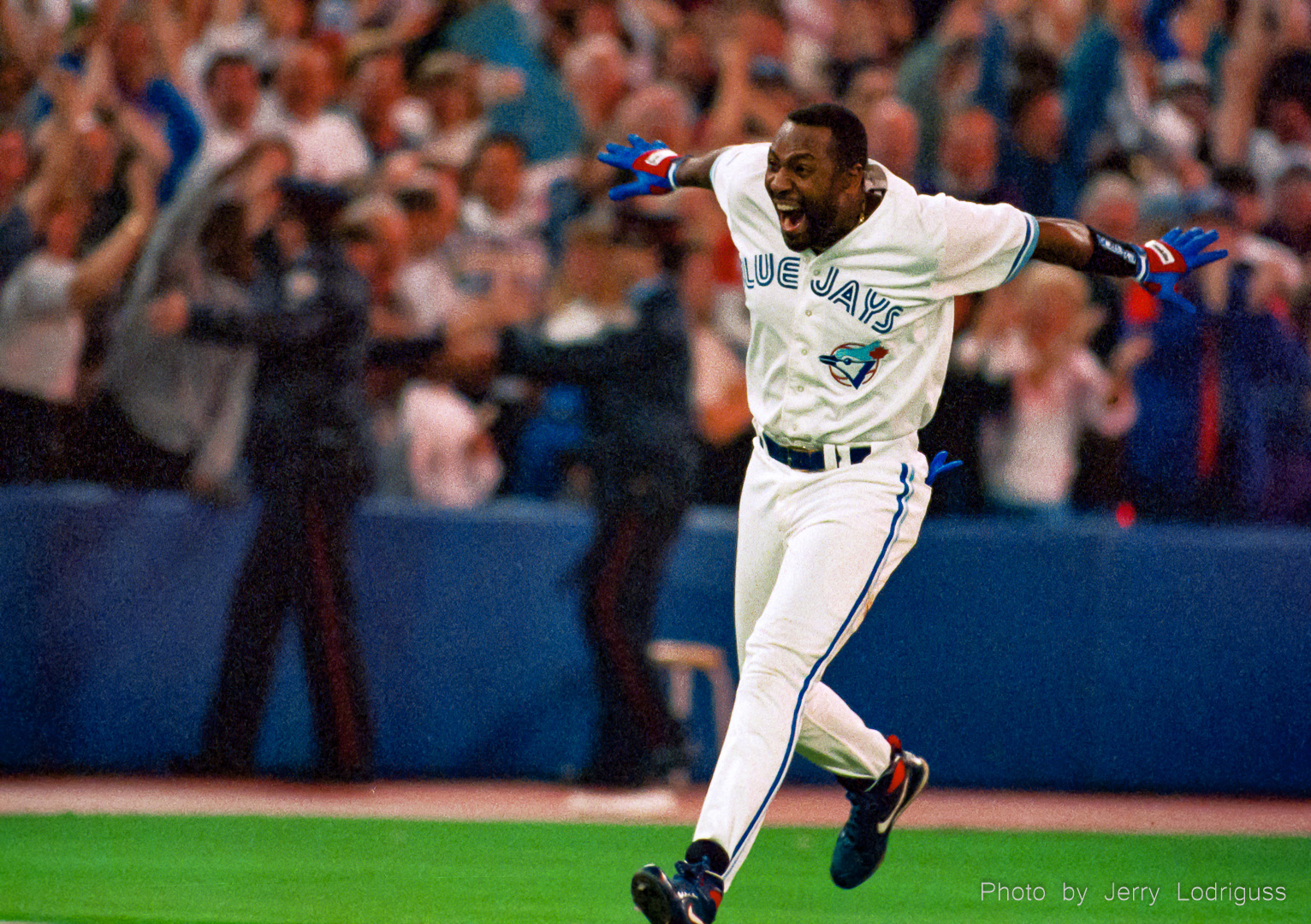 Toronto Blue Jays' Joe Carter celebrates on his way around the bases after hitting his game-winning, three-run home run in the bottom of the ninth to win the 1993 World Series.