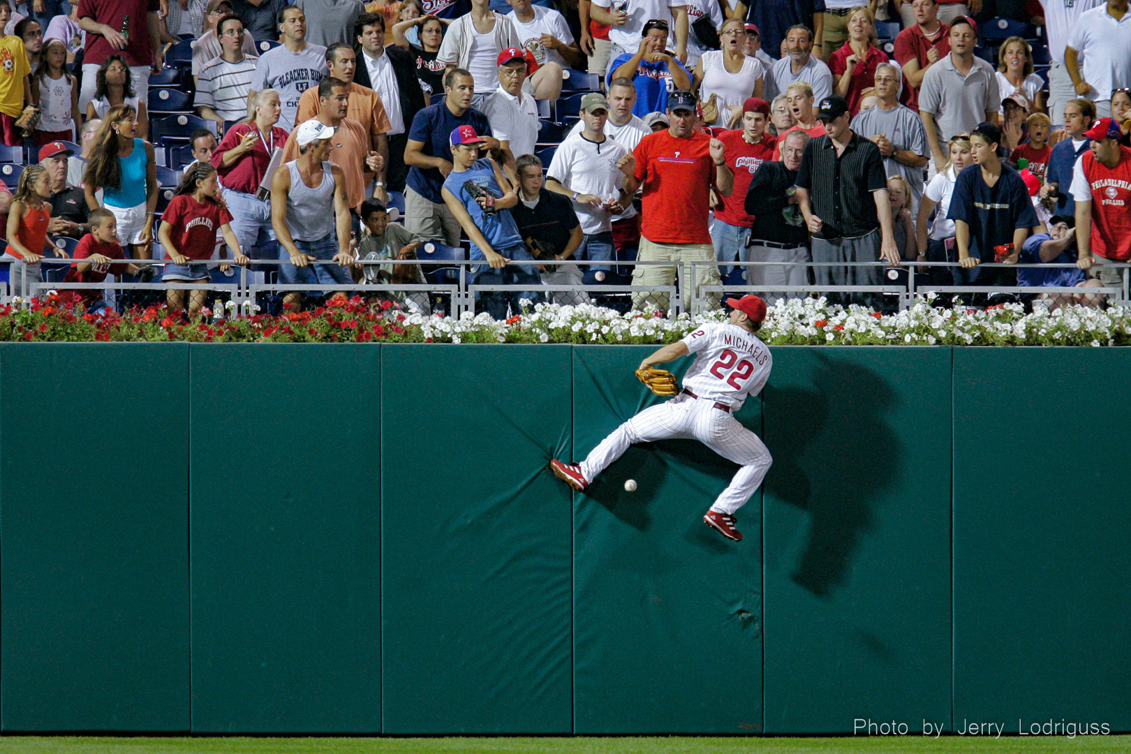 Phillies left fielder Jason Michaels goes high up on the wall but can't catch a ball hit by the Rockies Rodd Helton for a double in the 9th inning. The Philadelphia Phillies lost 5-4 to the Colorado Rockies in Philadelphia on Tuesday August 10, 2004.