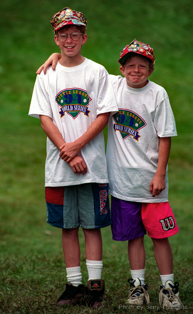 12 year-old Chris Johnson (left), and his brother, David, 9, of Bethlehem, PA, pose for a portrait at the 1994 Little League World Series. Both are avid baseball fans and pin collectors.