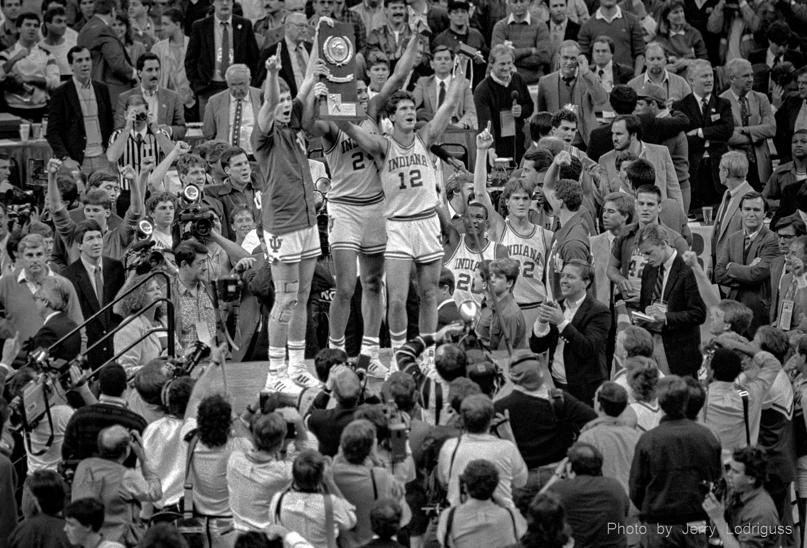 Indiana Hoosiers hold up championship trophy to celebrate 74-73 victory over Syracuse in in New Orleans in the  NCAA men's basketball championship game on March 30, 1987.