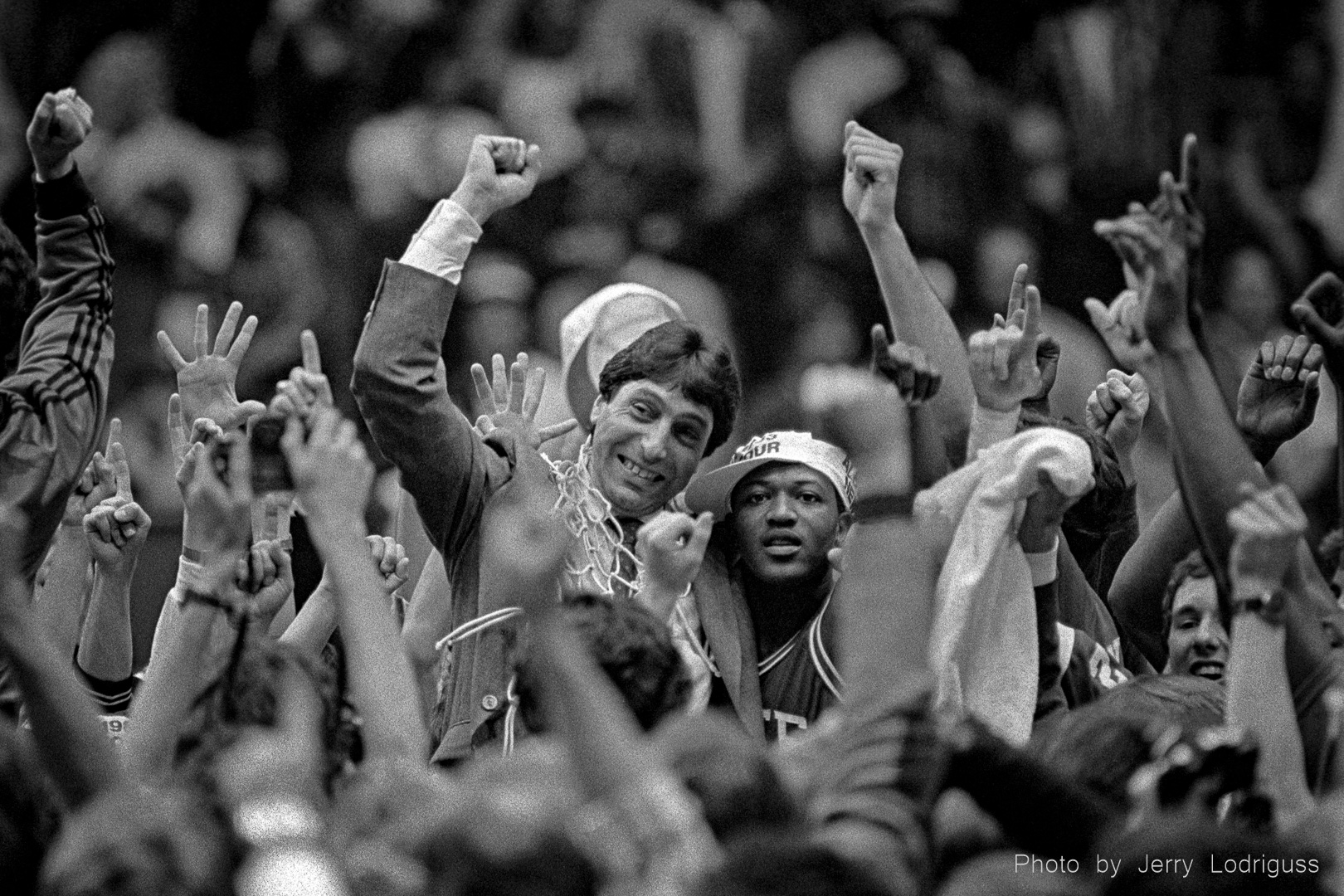North Carolina State coach Jimmy Valvano celebrates the Wolfpack's victory over Houston with Derrick Whittenberg after cutting down the nets after they won the NCAA Men's Basketball National Championship in Albuquerque in 1983.