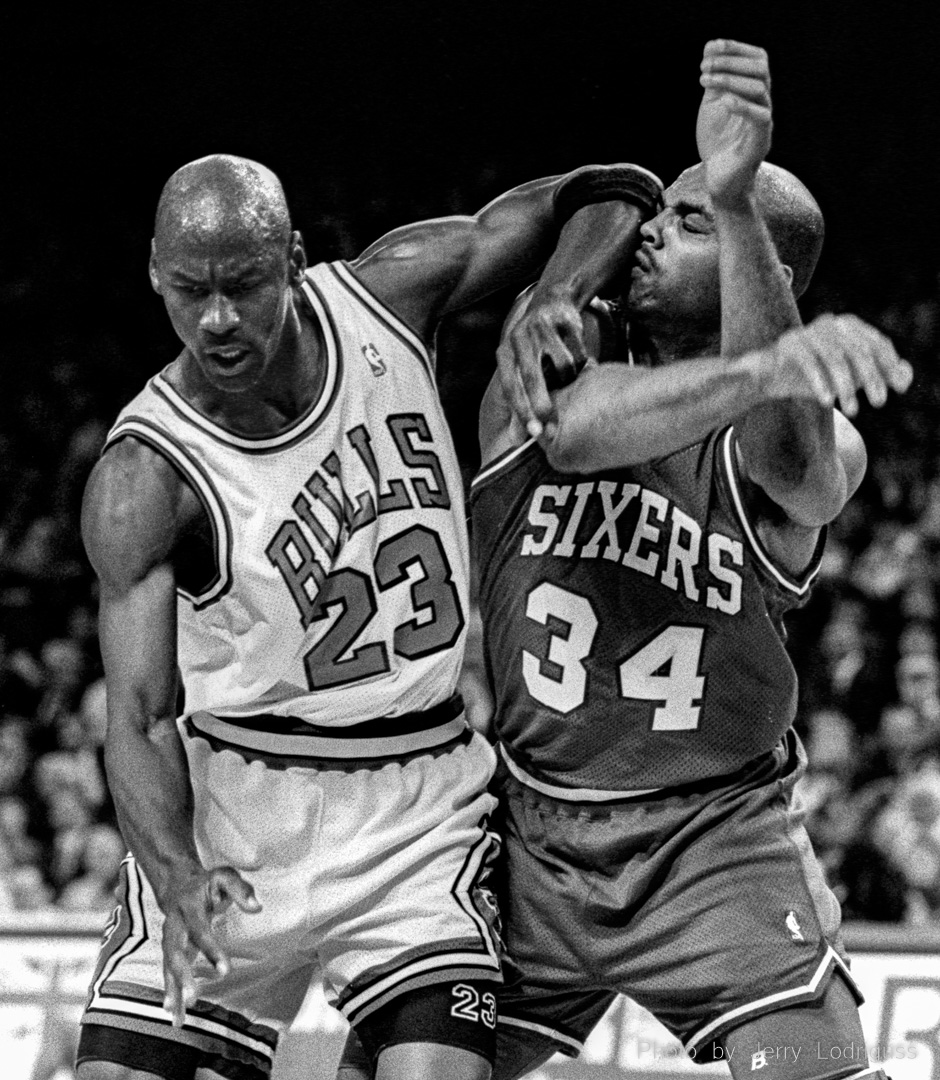 Chicago Bulls' Michael Jordan elbows the Philadelphia 76ers' Charles Barkley in the face during a 1991 playoff game in Chicago.