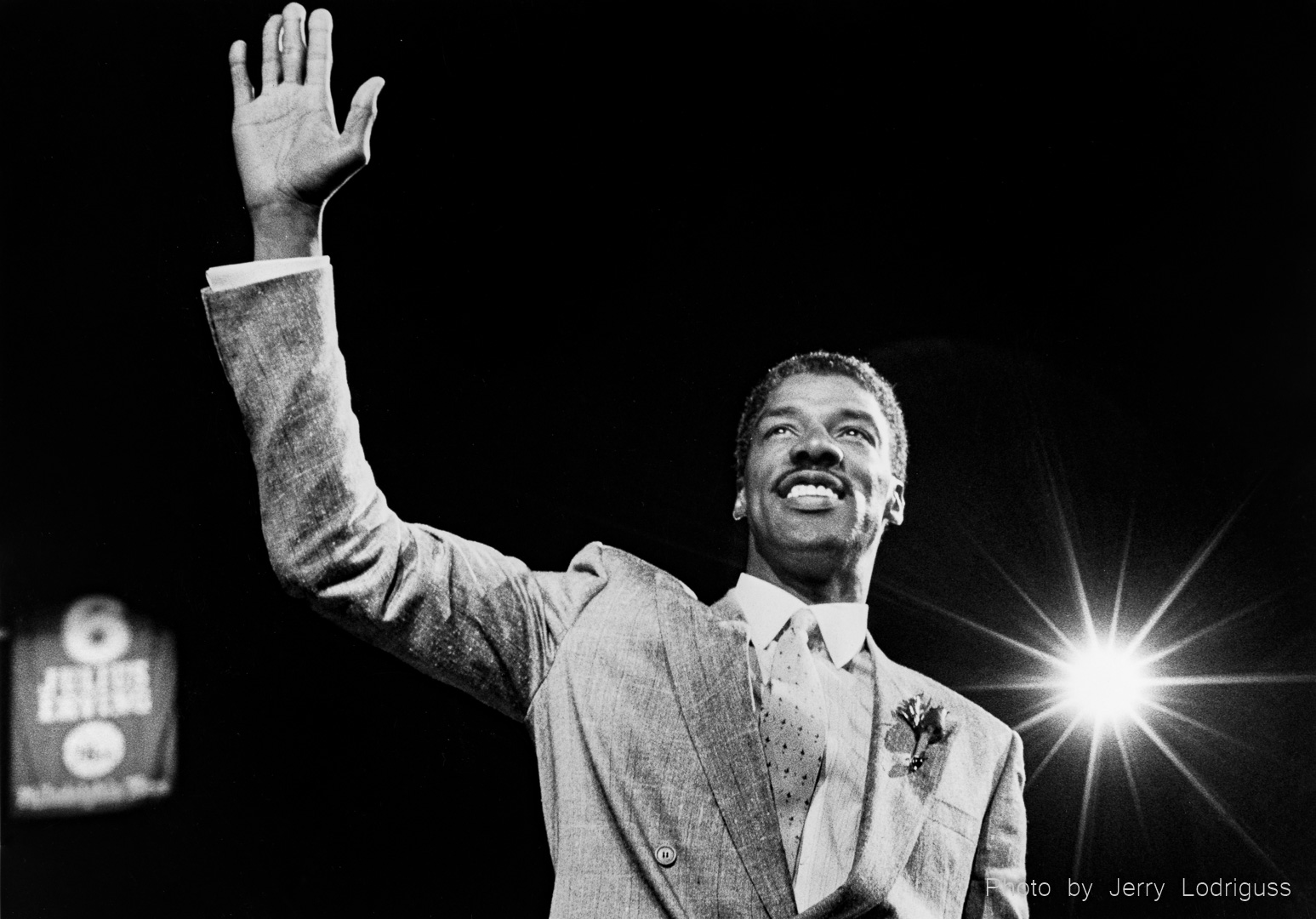 Julius Erving, "The Doctor", waves to the crowd during a standing ovation as his number 6 jersey is retired and raised to the rafters in the Spectrum in Philadelphia on  April 18, 1988.