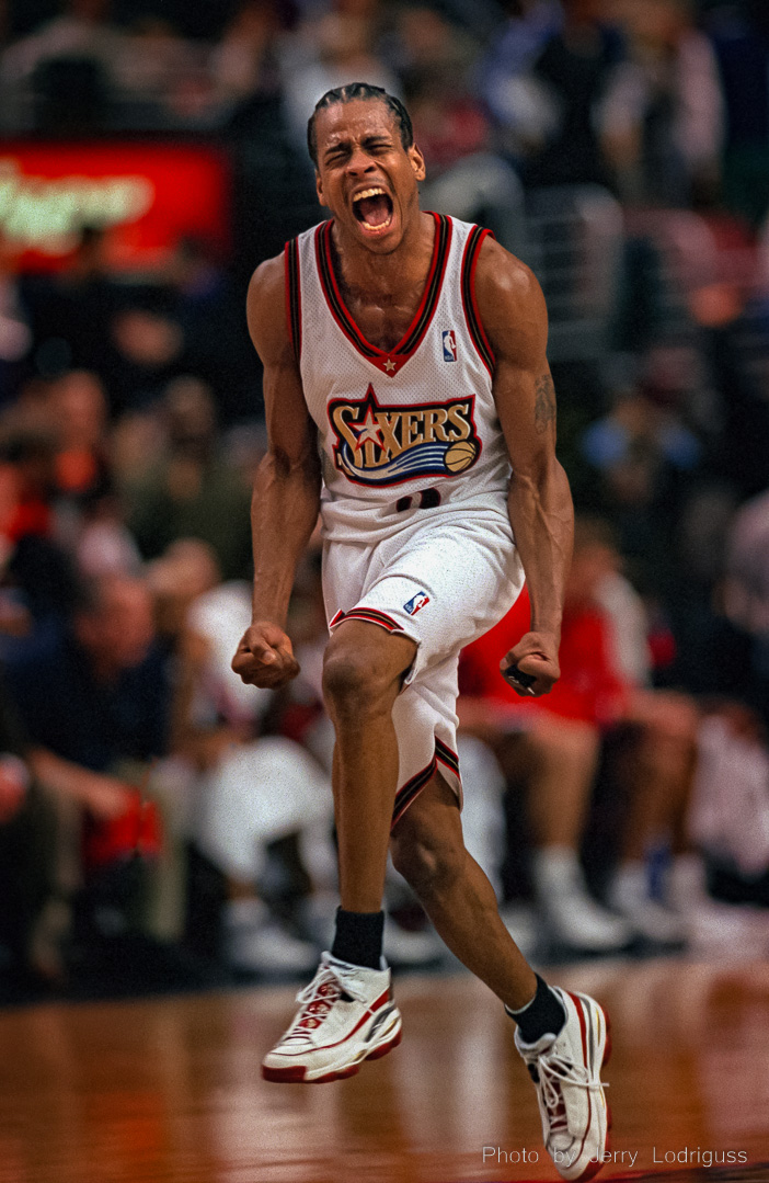 Philadelphia 76ers Allen Iverson exults as he runs down the court after sinking a basket in the final moments of the 76ers win over the Chicago Bulls and Michael Jordan during this 1998 game.