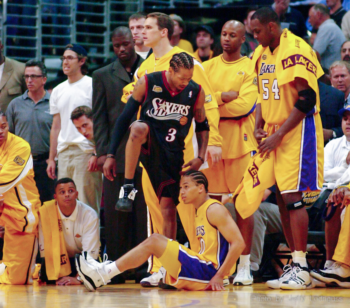 The Philadelphia 76ers Allen Iverson famously steps over the Los Angeles Lakers Tyronn Lue with cold disregard after draining a three-pointer to put the Sixers up by 103-99 with 39.2 seconds left in overtime of the Sixers surprising win over the Lakers in game 1 of the NBA Championship Finals in Los Angeles on June 6, 2001.