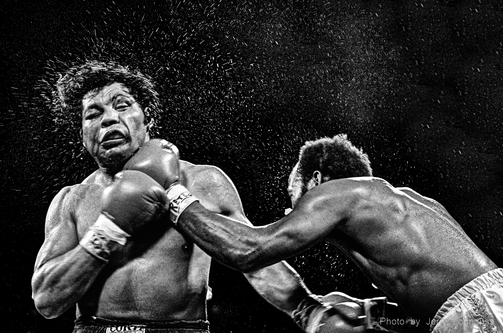 Sweat flies from Victor Galindez' head as Marvin Johnson lands a right in Johnson's victory during their World Boxing Association light-heavyweight championship fight in New Orleans on November 30, 1979 .
