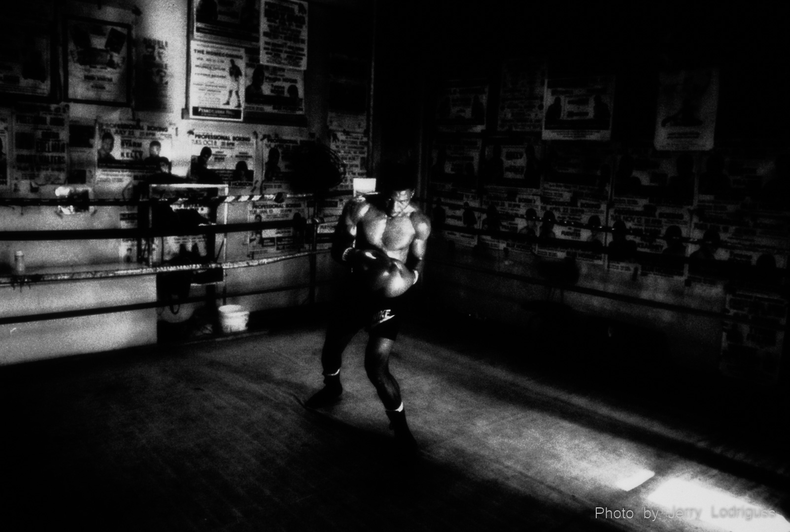 Bernard Hopkikns works on his form and footwork in a shaft of light at Champ's Gym.