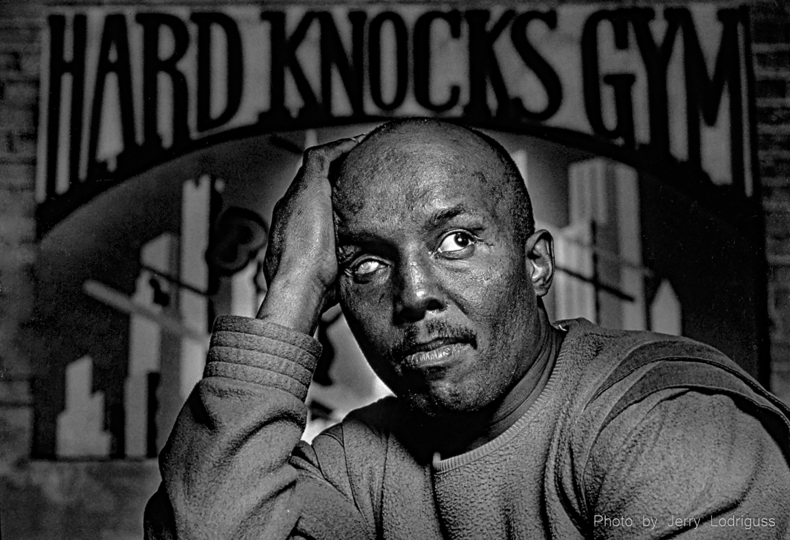 Gypsy Joe Harris poses for a portrait at the Hard Knocks Gym in Philadelphia in 1989. Harris, legally blind in his right eye from an injury he suffered in a street fight at age 11, was 43 years old when this photo was taken. He was out of boxing for 20 years, since the day the Pennsylvania State Athletic Commission decided to ban him from boxing forever because he was blind in one eye. Harris, who built up a record of 24 wins and 1 loss and made the cover of Sports Illustrated, was one of Philadelphia's most popular boxers. In the years since he was forced to stop boxing, Harris beat addictions to heroin and alcohol, and survived three heart attacks.