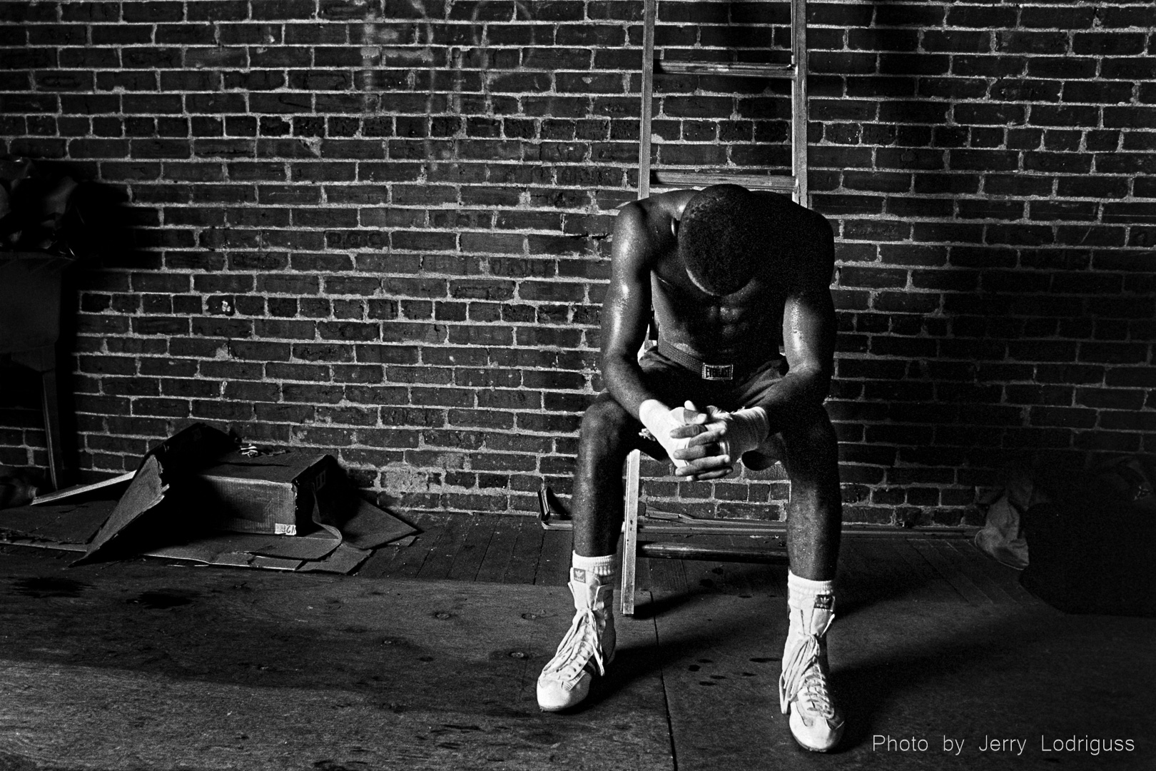 Upcoming yourg boxer Tony Green rests after a hard workout at Champ's gym in Philadelphia.