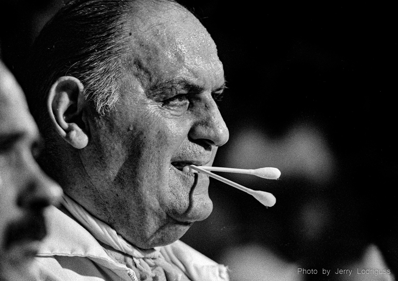 The "cut man" waits to do his work between rounds.