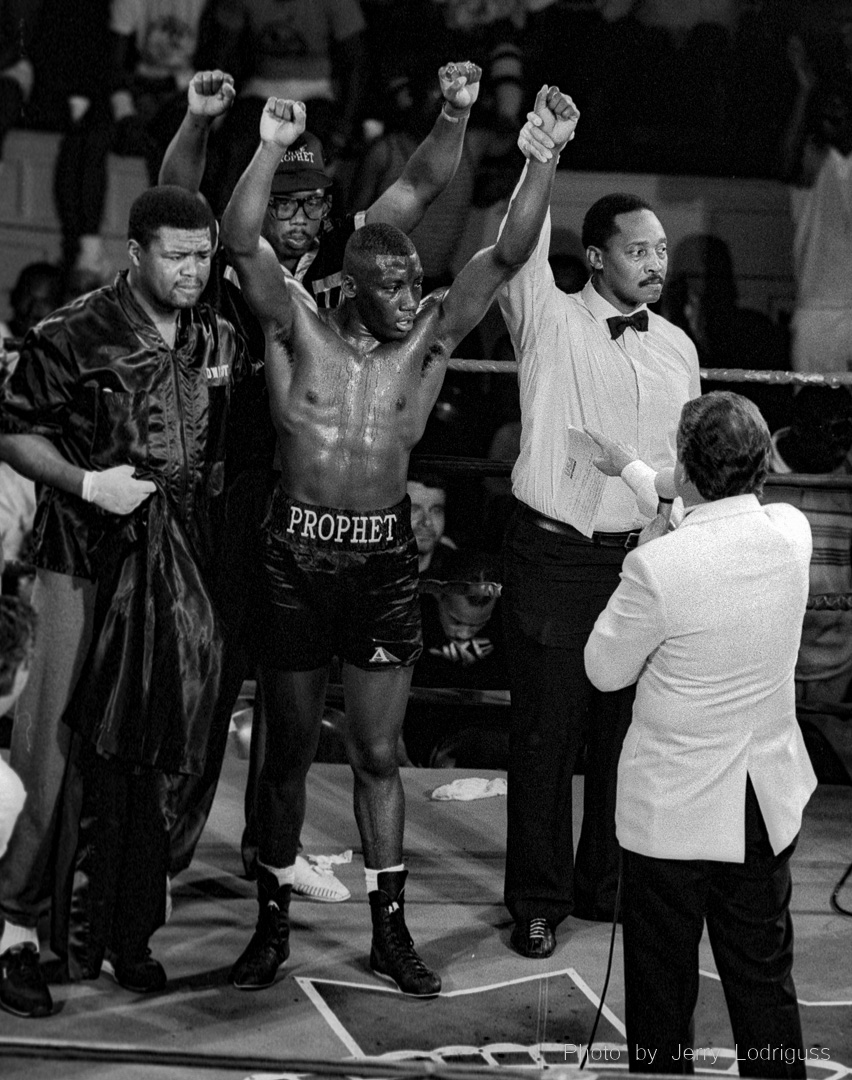 Andre "Thee" Prophet raises his arms in victory after a win at the Blue Horizon Boxing Club.