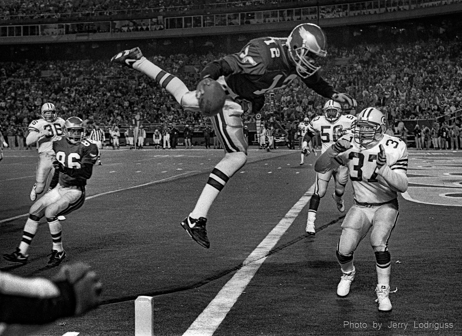 Philadelphia Eagles quarterback Randall Cunningham flies through the air on the way to a touchdown against the Green Bay Packers on December 16, 1990 at Veterans Stadium in Philadelphia.