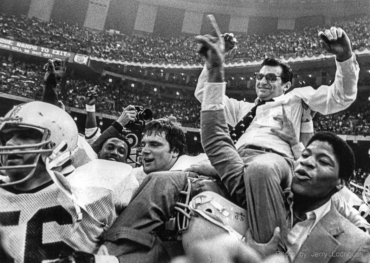 Penn State football coach Joe Paterno is carried off the field after the Nittany Lions defeated the Georgia Bulldogs 27-23 to claim the National Championship in the Sugar Bowl in New Orleans on January 1, 1983.