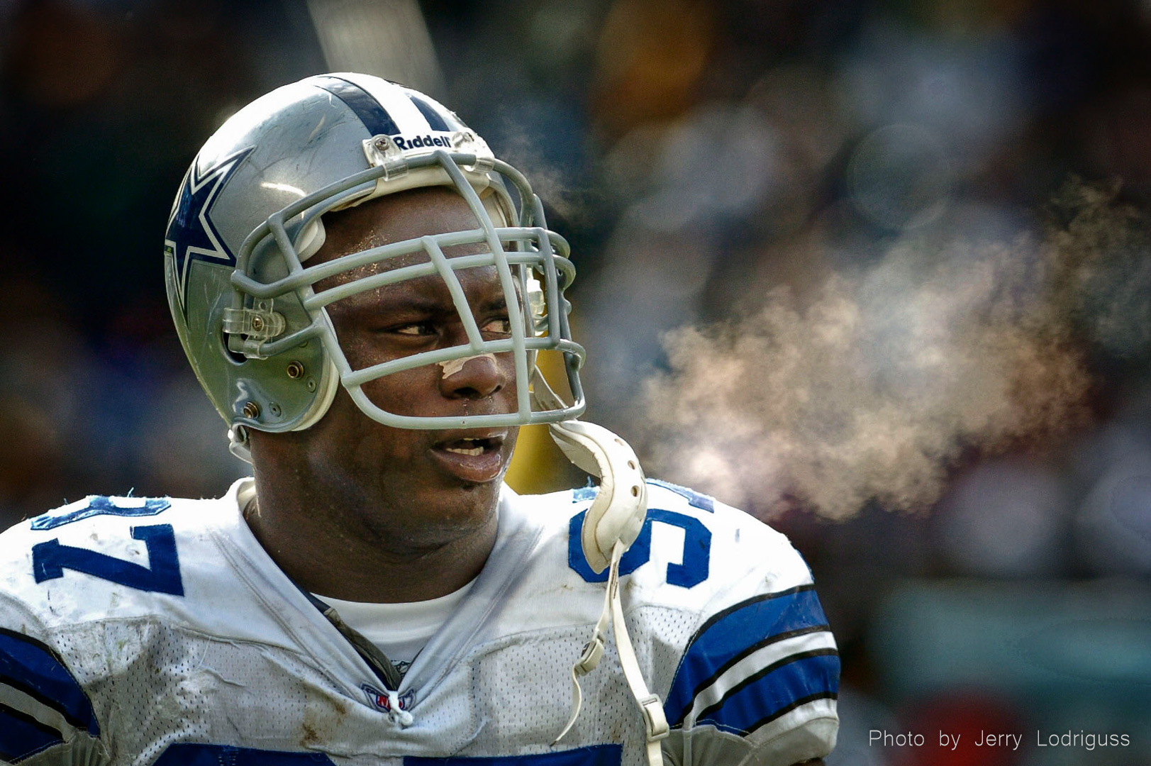 With steam coming from his breath in the cold, Cowboys La'Roi Glover walks off the field after an Eagles score . The Philadelphia Eagels beat the Dallas Cowboys 36-10 in Philadelphia on Sunday December 7, 2003.