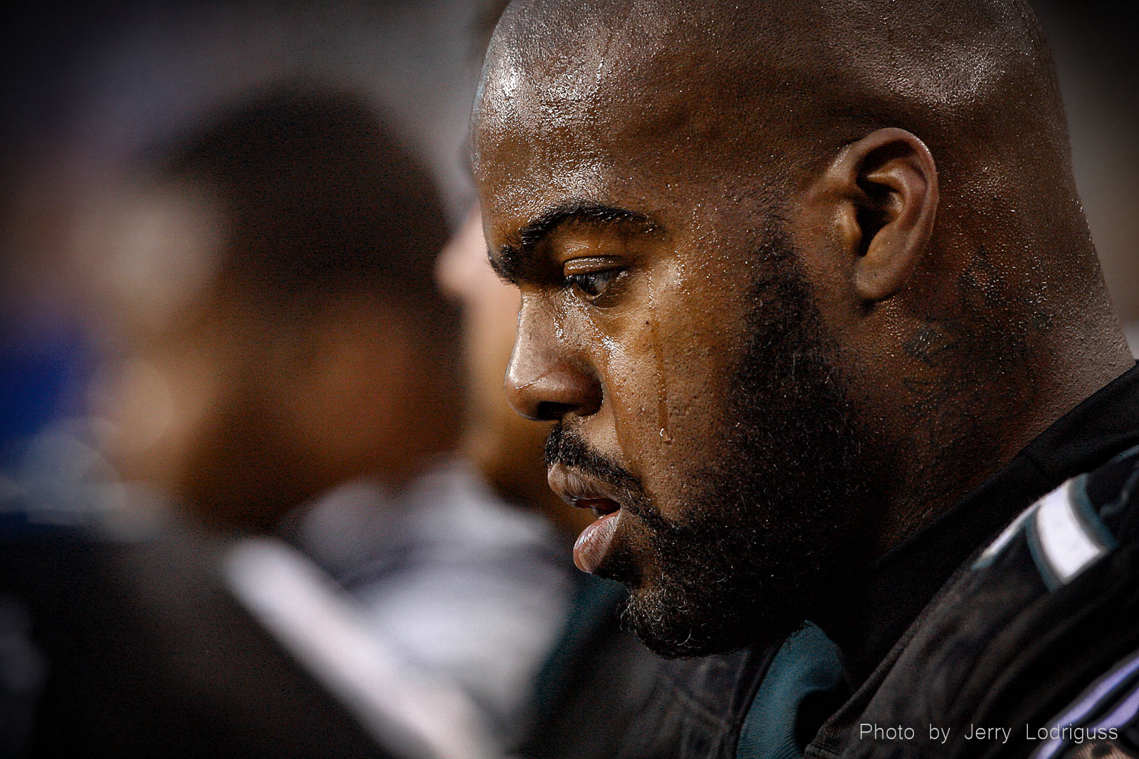 William Thomas sits on the bench, seemingly in a state of shock, at the end of the Eagles' 31-13 loss to the Titans in Philadelphia on October 19, 2006.