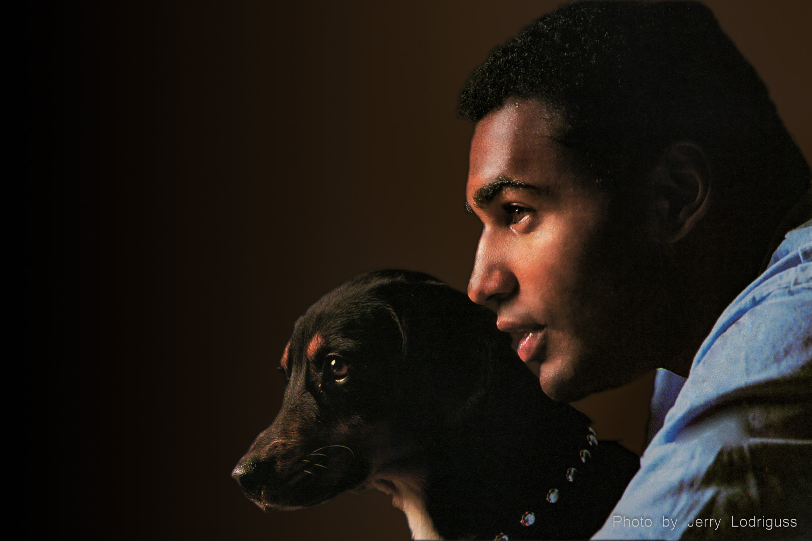 New Orleans Saints running back Rueben Mayes poses for a portrait with his pet dog at home in Metairie, La. Mayes won the NFL Offensive Rookie of the Year Award in 1986 and was named to the Pro Bowl twice during his pro career.