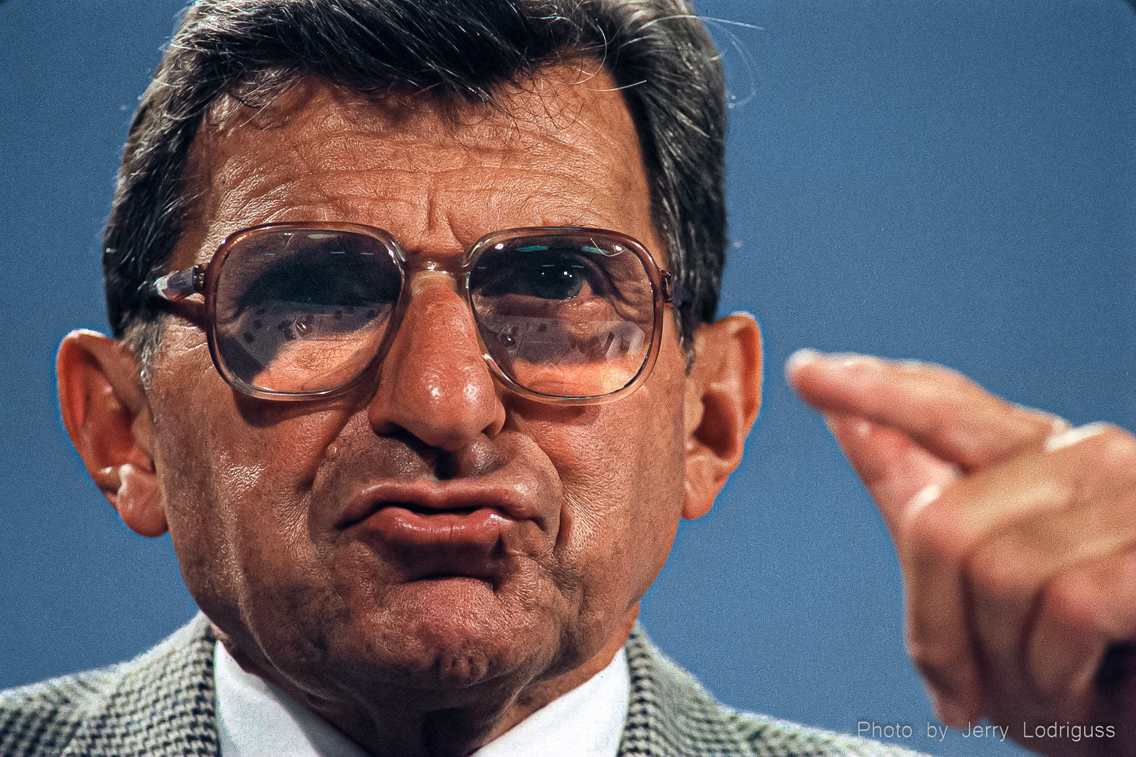 Penn State head football coach and athletic director Joe Paterno answers questions on media day at Beaver Stadium in 1998. Paterno coached for 45 years from 1966 to 2011. With 409 victories, Paterno is the most victorious coach in NCAA FBS history. He won 2 national championships in 1982 and 1986. Paterno was ultimately fired for allegations that he pesuaded university officials to refrain from reporting child sexual abuse by his defensive coordinator Jerry Sandusky to authorities in 2001. Sandusky was arrested on 52 counts of child sexual abuse occurring between 1994 and 2009, including allegations of incidents on the Penn State campus and the football program's shower facilities that were reported to Paterno, and about which, he did nothing.