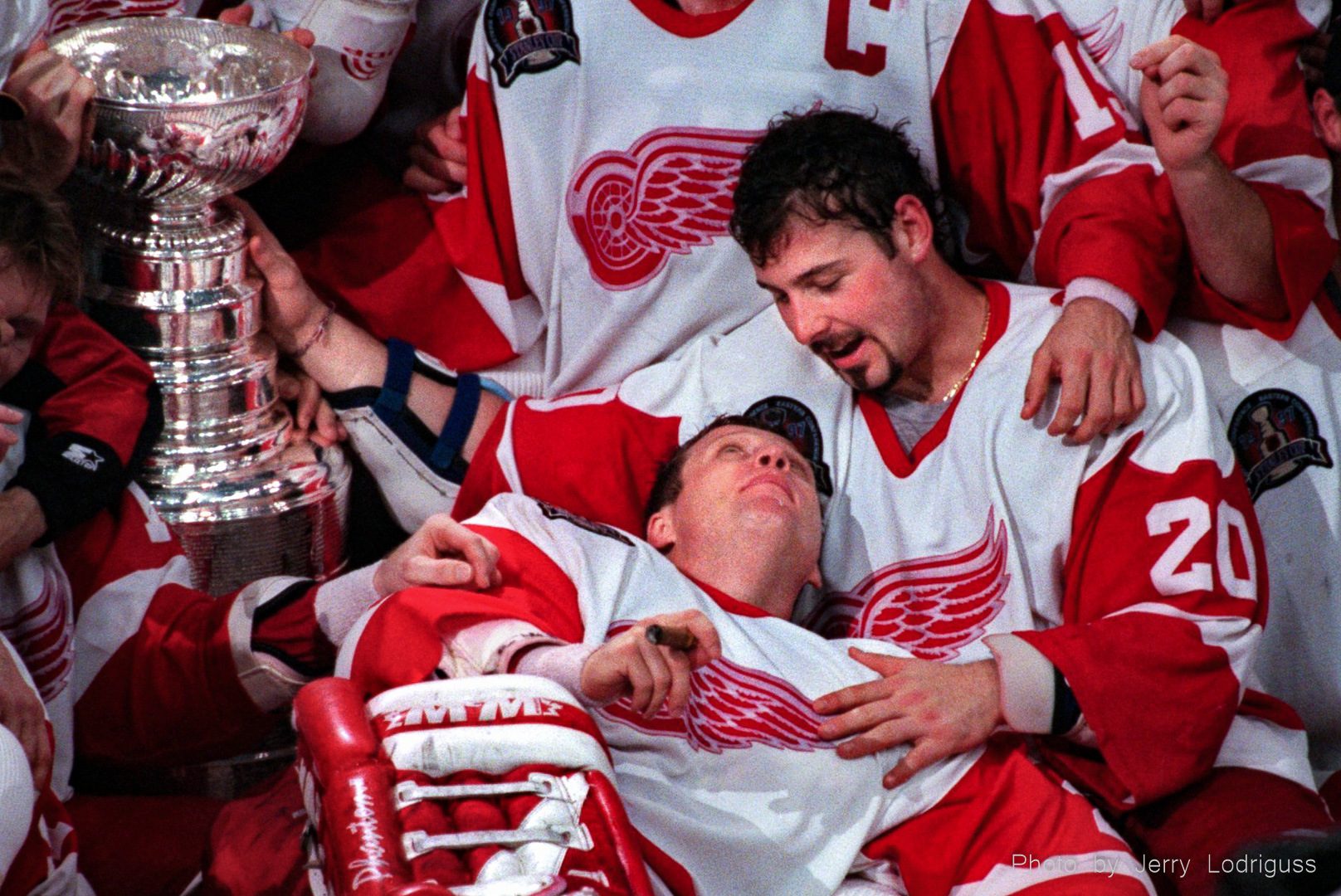 Detroit MVP Mike Vernon (center) shares a quiet moment and a deep look into the eyes of teammate Martine Lapointe while they pose with the Stanley Cup after sweeping the Flyers in four straight games in the NHL finals on June 7, 1997 in Detroit.