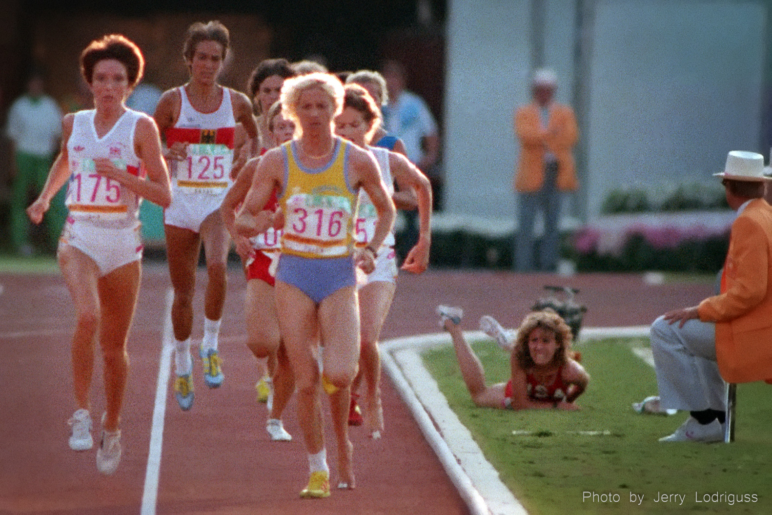 USA's Mary Decker grimaces in pain and dejection as her Olympic dreams fall to the infield along with Decker after becoming entangled with Zola Budd in the finals of the women's 3,000 meters.<br /><br />Decker, considered by many to be the greatest women's distance runner in the world at that time, having set six world records in 1982 at distances ranging from the mile to 10 000 meters, had her Olympic dreams crushed once again. Budd, who had taken over the lead after the collision, faded to finish seventh with tears coming down her face as she said she could not endure the boos of the crowd. Budd had considered Decker one of her heroes while growing up.