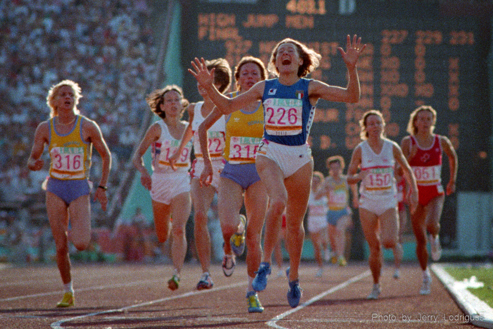 Maricica Puica (226) of Romania reacts to winning the women's 3,000 meters  in an Olympic record time of 8:35.96 after Mary Decker fell out of the race after a trip up with Zola Budd.