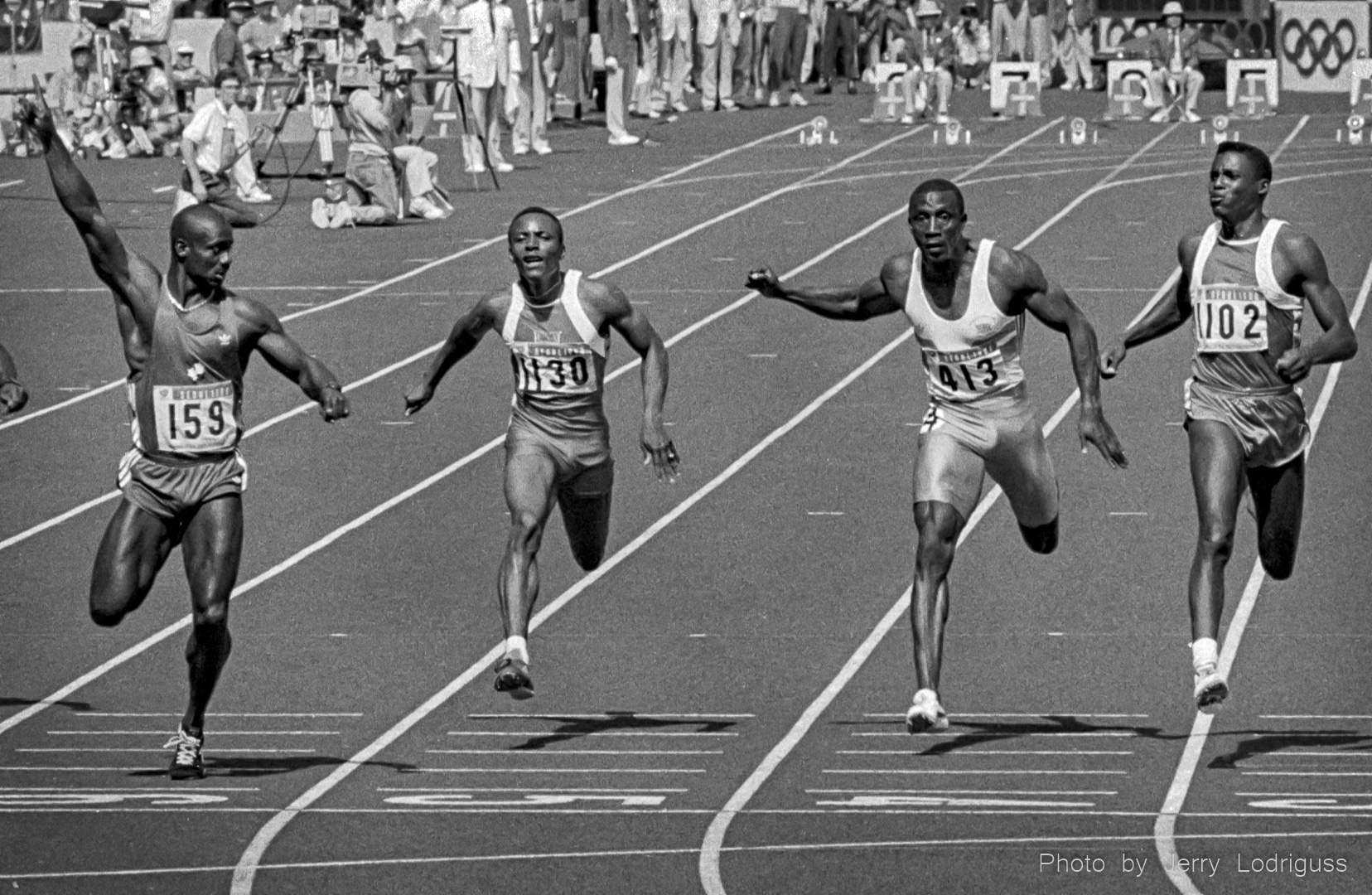 Ben Johnson raises his hand in victory as he looks at rival Carl Lewis in the finals of the men's 100 meter dash at the 1988 Seoul Olympic Games. Johnson was later disqualified for drug use, giving the gold medal to Lewis.