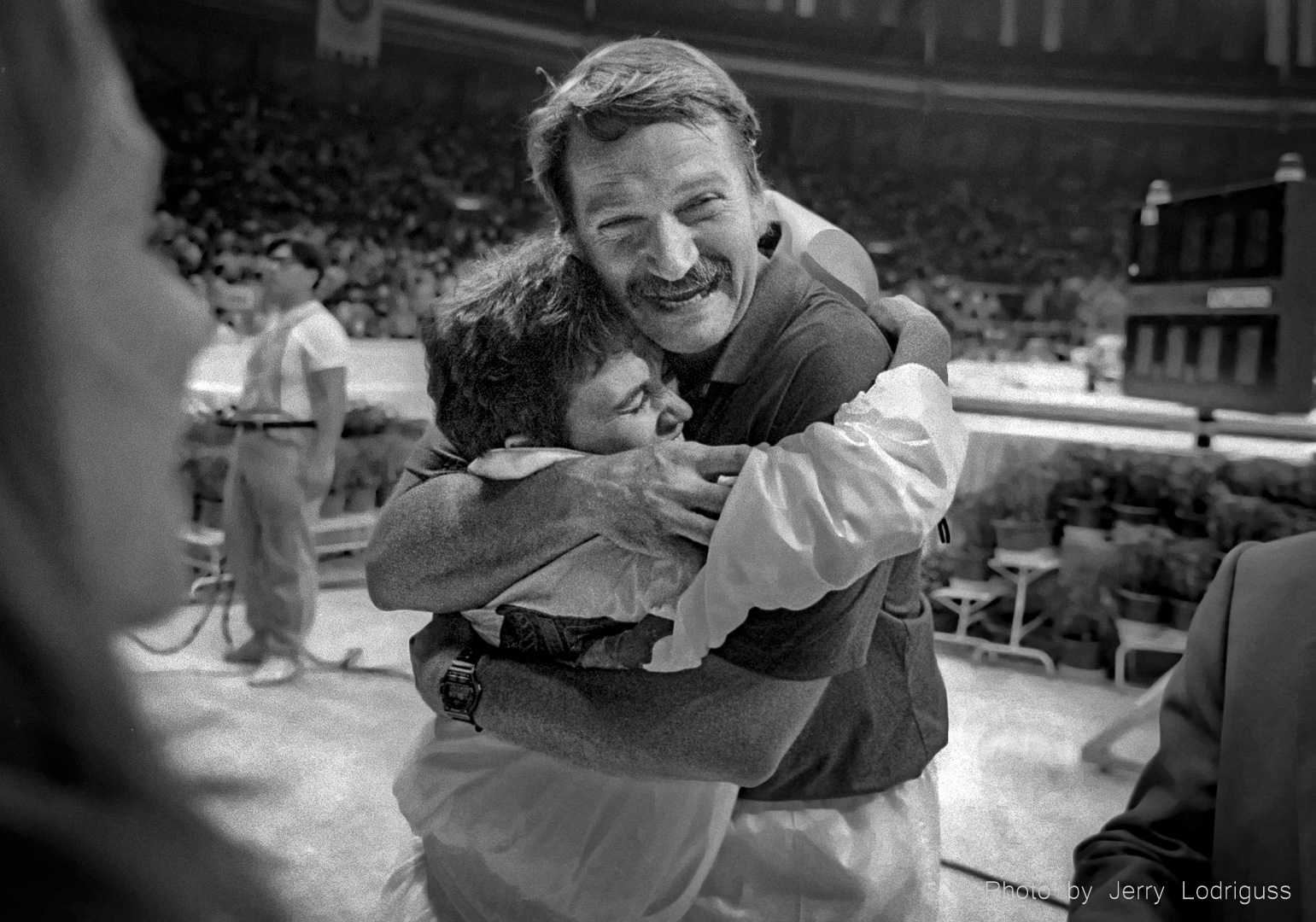 USA Women's gymnastics coach Bela Karolyi hugs Phoebe Mills after she became the first American female gymnast to win a medal in a fully-attended Olympics, and the only American gymnast, male or female, to medal in gymnastics the 1988 Olympics in Seoul.