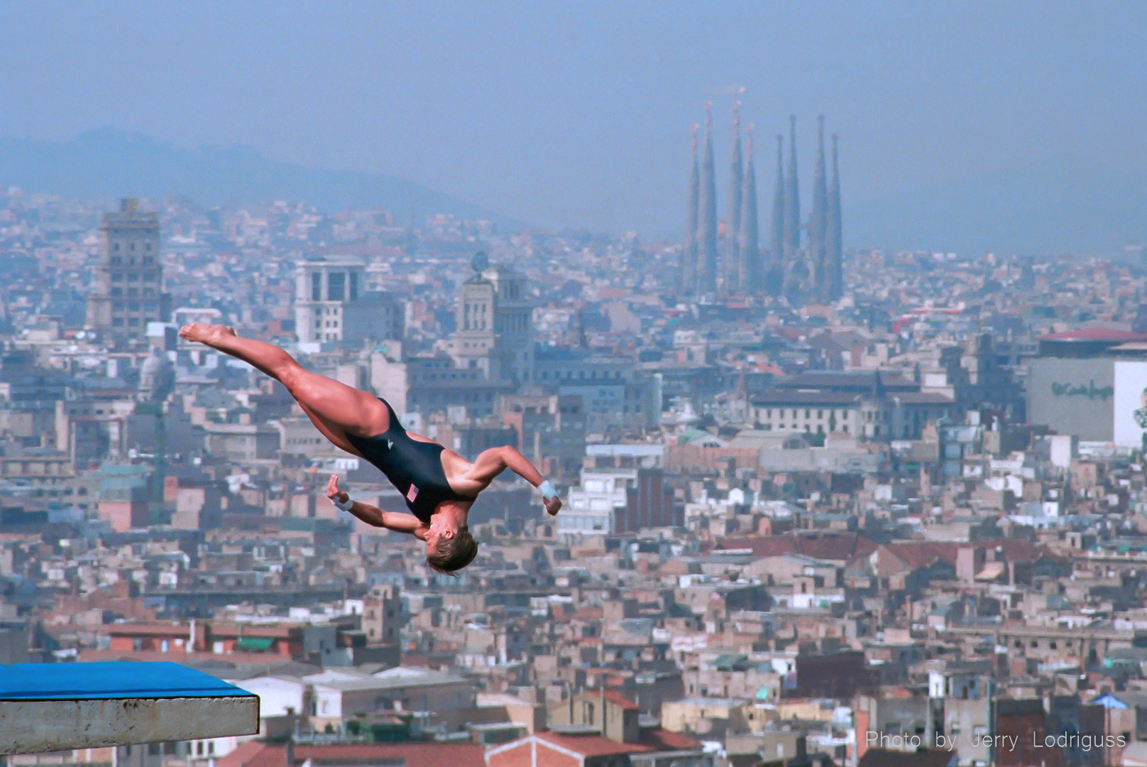 With a spectacular view of the city of Barcelona in the background, 29 year-old Mary Ellen Clark of Newtown Square, Pa., wins a bronze medal on her final dive in the women's 10 meter platform competition during the 1992 Olympic Games.