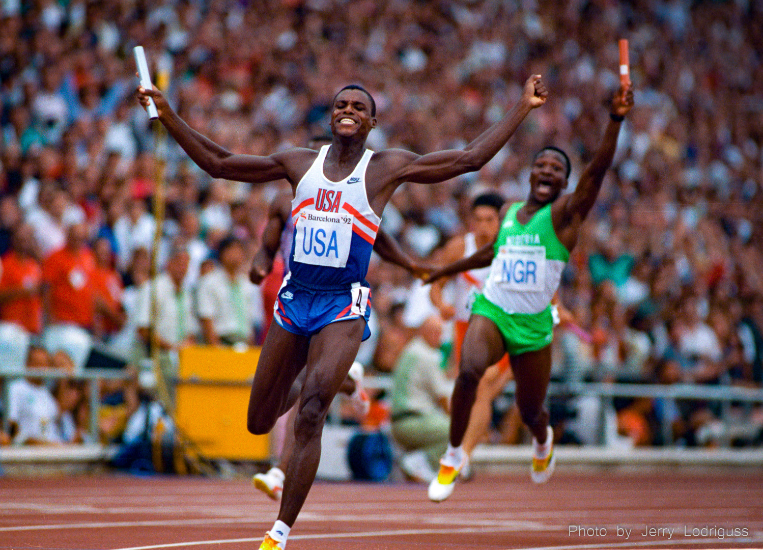 Carl Lewis anchor the US to a world record gold medal in the 4x100 meter relay at the 1992 Barcelona Olympics. Lewis was not even supposed to run on the team, but was added when a teammate was injured.  Lewis has won 9 gold medals at 4 Olympics. He won golds in the 100, 200, long jump and 400-meter relay at Los Angeles in 1984, golds in the 100 and long jump at Seoul in 1988,  golds in the long jump and 400-meter relay in Barcelona and a gold in the long jump in Atlanta in 1996.