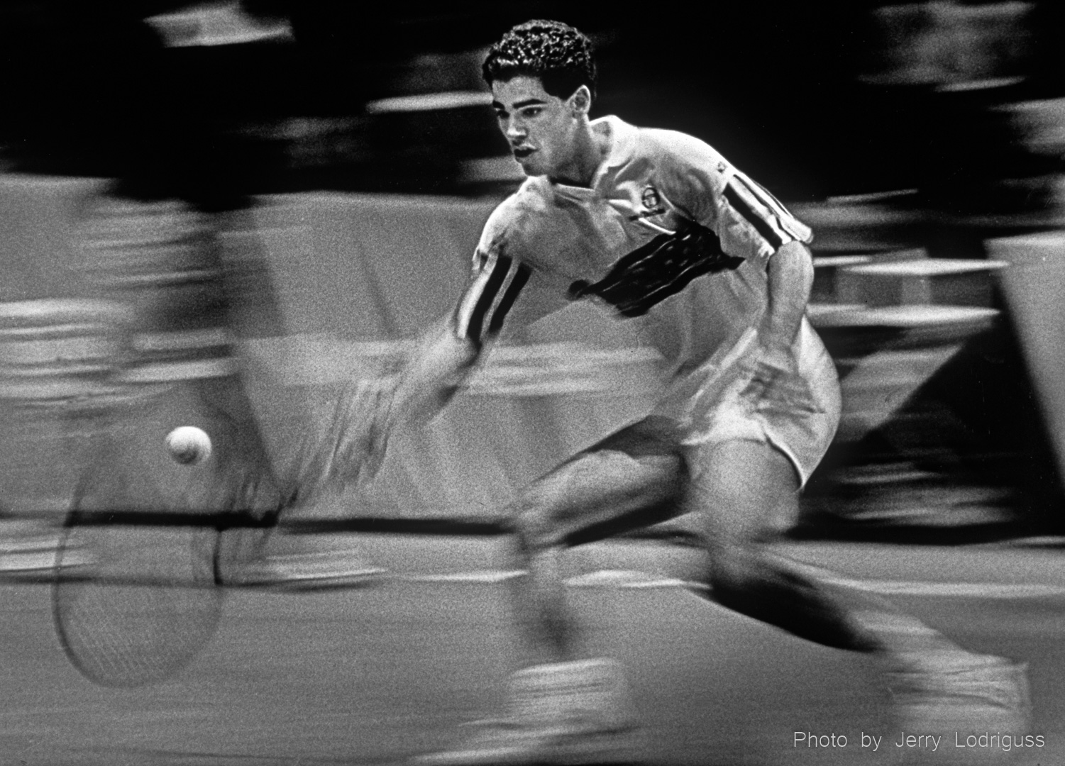 The ball seems to stand still as everything else around it is in motion during this slow shutter speed exposure of Pete Sampras winning the finals of the US Pro Indoor Tennis Championship in Philadelphia in 1992.