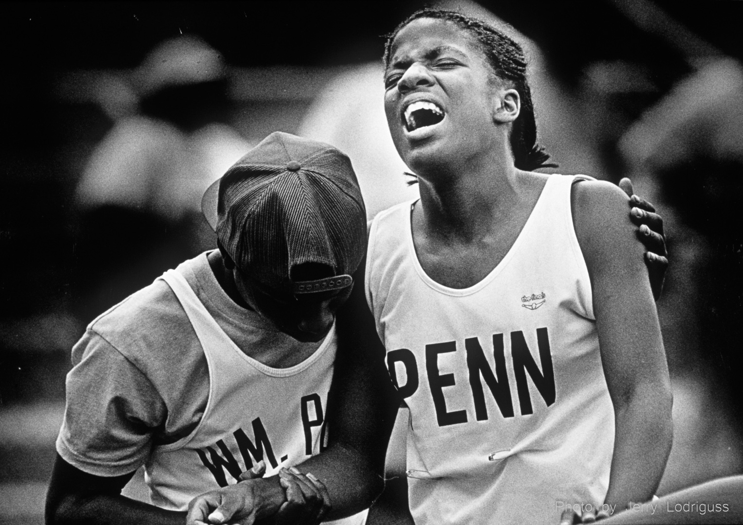 Penn's Marcia Rush, in agony after winning the women's 400 meter run during the 1988 Penn Relays, in comforted by a teammate.